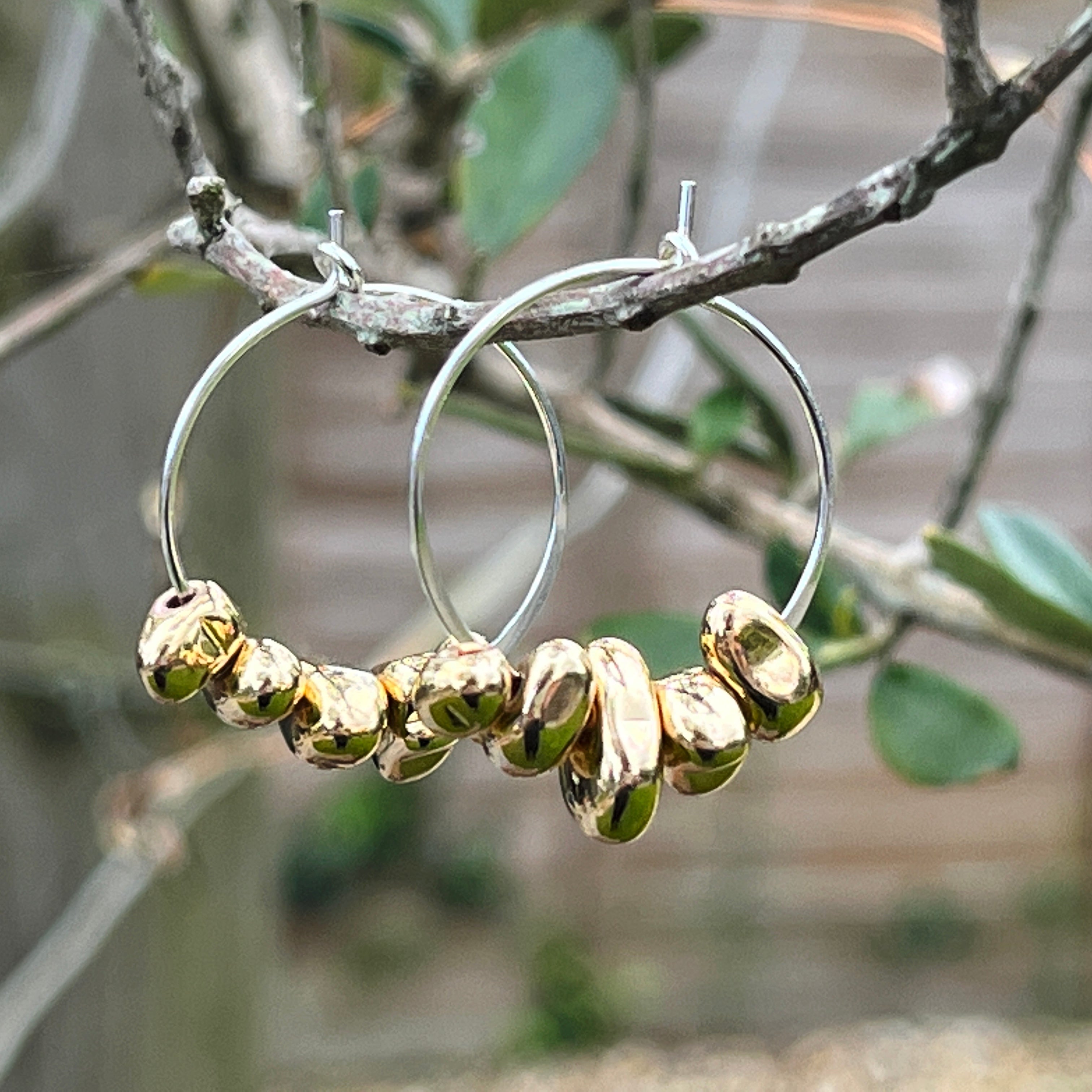 sterling silver hoop anxiety earrings with gold hematite charms hanging