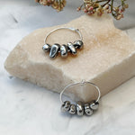 sterling silver hoop anxiety earrings with silver hematite charms flatlay