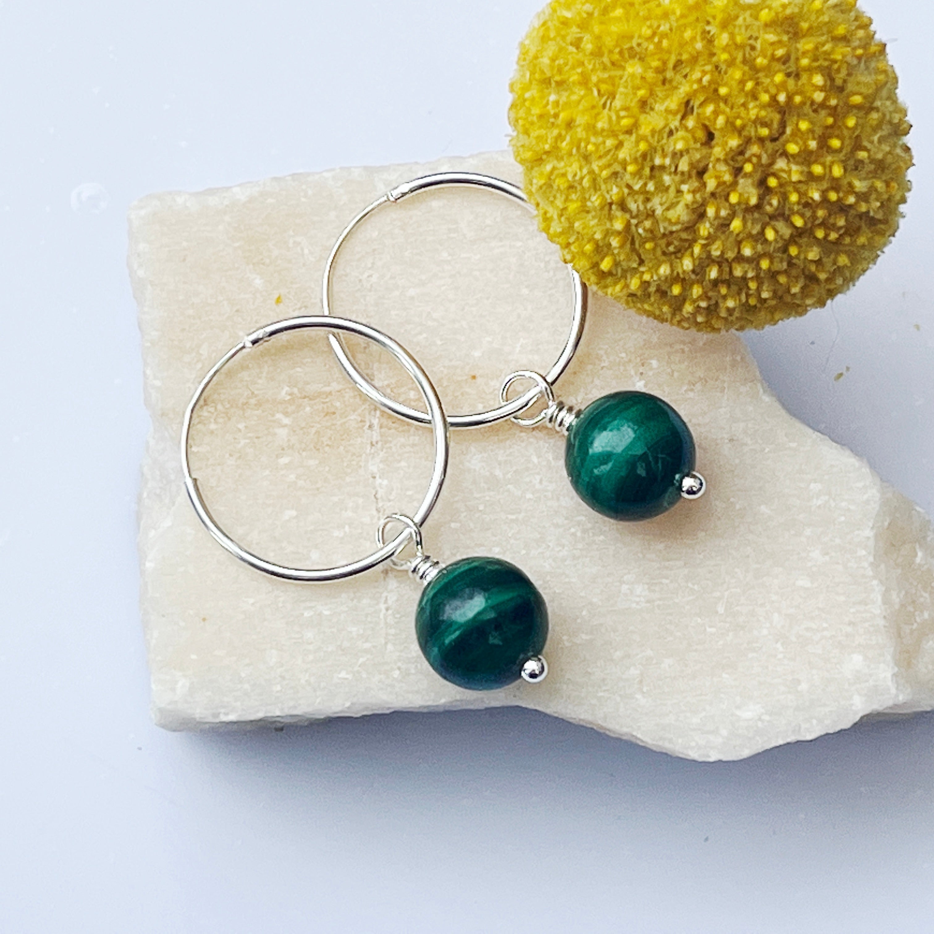 Sterling silver malachite handmade hoop earrings wire wrapped flatlay